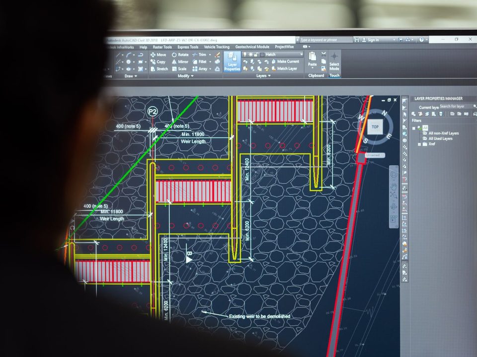 Engineer reviewing a schematic on screen