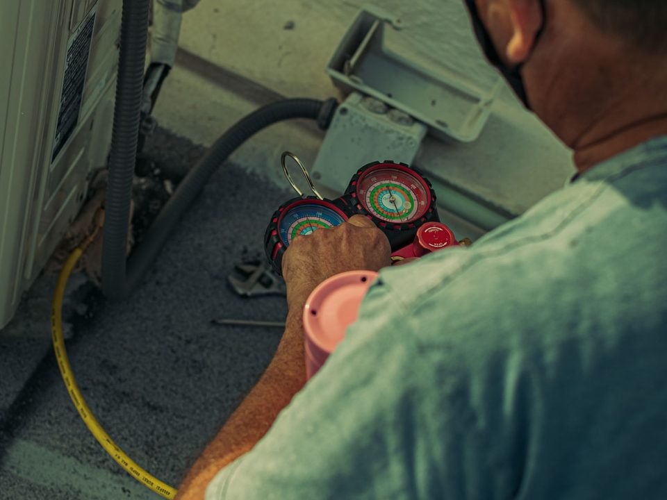 Technician taking readings on equipment
