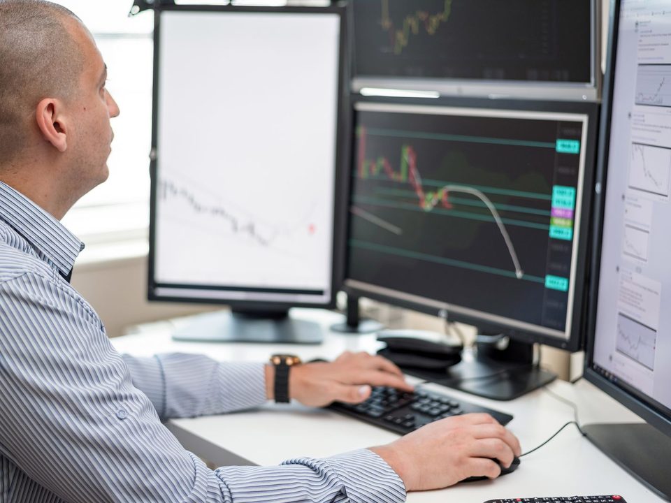 Engineer monitoring systems across several screens