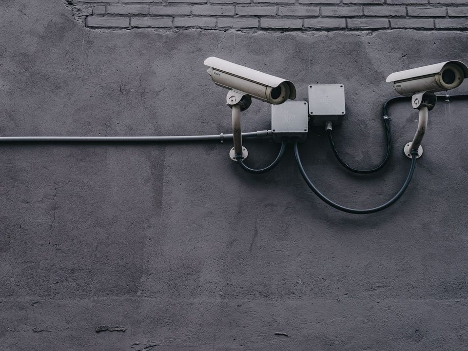 Security cameras mounted on a wall